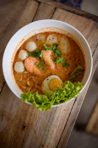 istock Authentic Thai Tomyum soup noodles with seafood and egg 1202401342