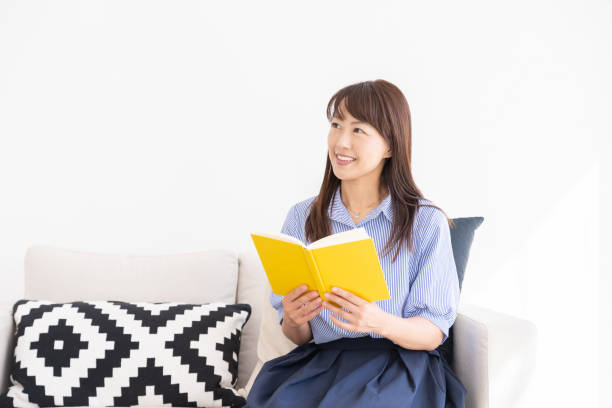 istock asian woman who reads a book 1202401872