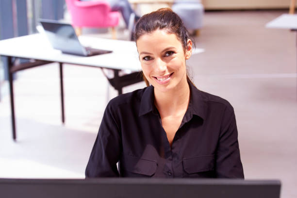 istock Attractive businesswoman working on computer in the office 1202403387