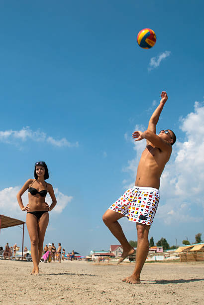 istock young people playing volleyball on the beach 120240682
