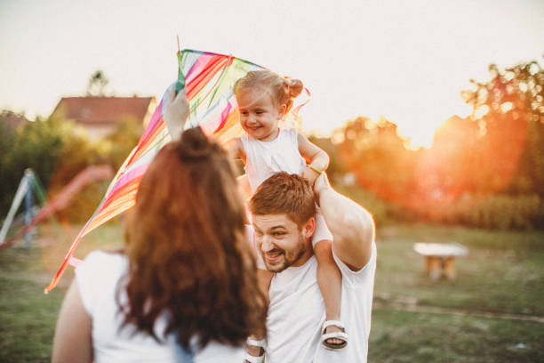 istock Smiled family playing in nature 1202413139