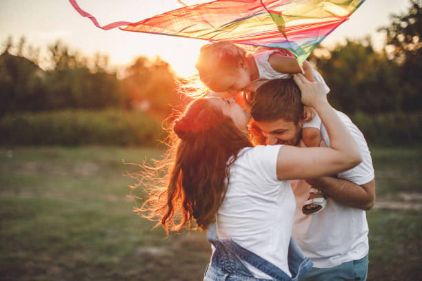 istock Smiled family playing in nature 1202414093
