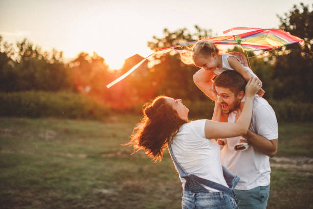 istock Smiled family playing in nature 1202414879