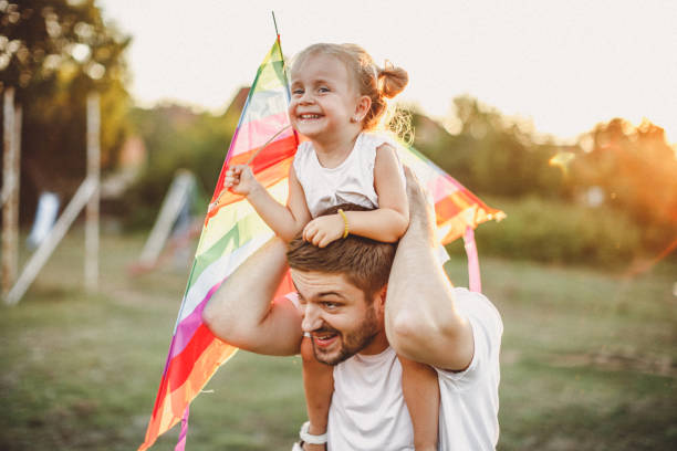 istock Smiled family playing in nature 1202415169