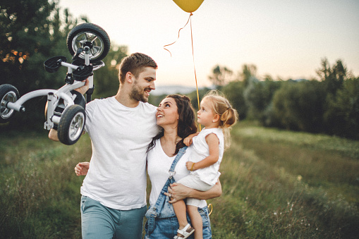 Parents playing with girl