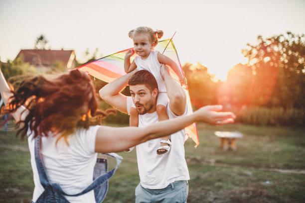istock Smiled family playing in nature 1202415961