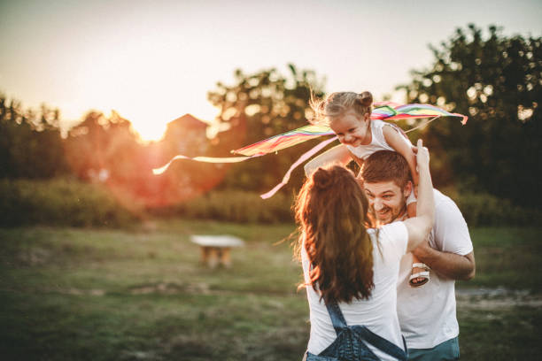 istock Smiled family playing in nature 1202416169
