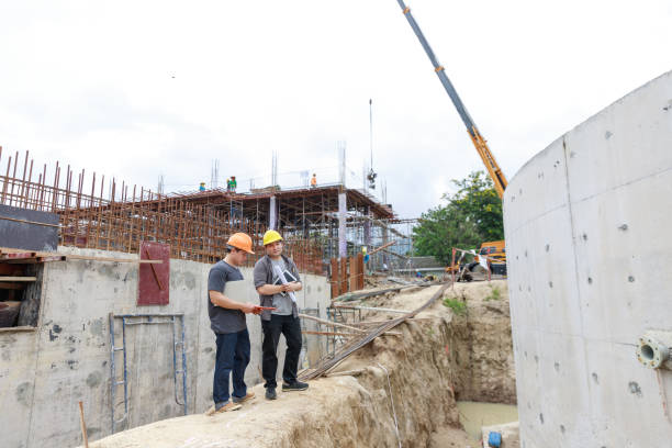 istock Construction concept of Engineer and Architect working at Construction Site with blue print 1202418329