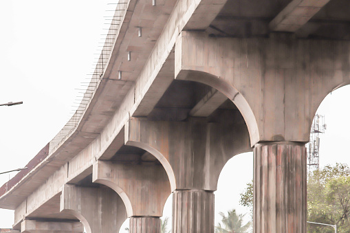 An Under Construction Cement Concrete Columns Iron Flyover Bridge With Pillars In India