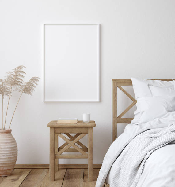 istock Mockup poster frame in white cozy bedroom interior, Scandinavian style 1202419934