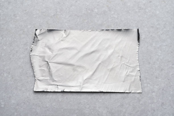 istock Foil tape sticker on gray surface with copy space 1202424501