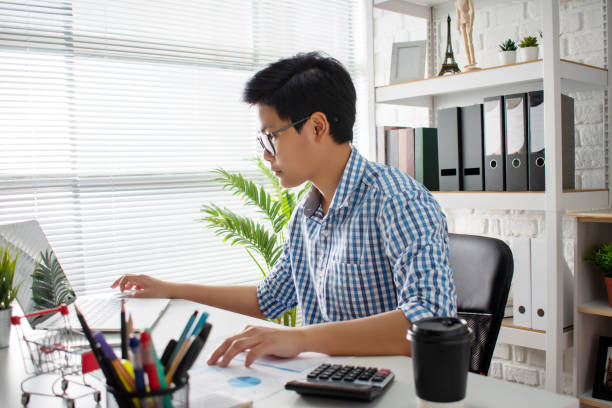istock Business people work seriously by the window in the office. 1202426455