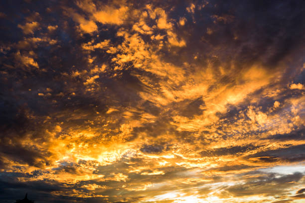 istock Colorful beautiful sunset with the orange cloud background 1202426784