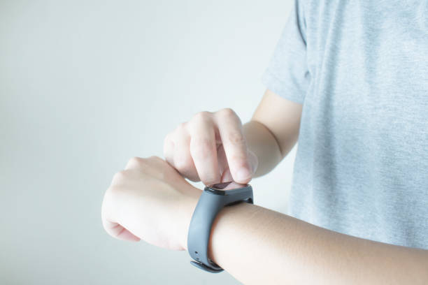 istock Women use touch hands on the black smartwatch screen in your hand. 1202431479