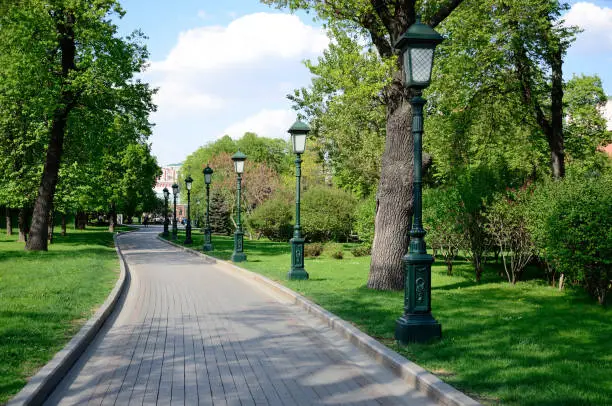 Street lights along a footpath in the Alexander Garden in Moscow on a summer day