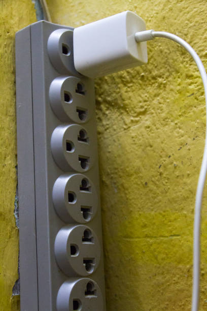 istock White charger plugged into power 1202433447