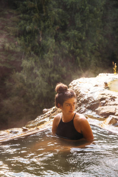 istock woman resting in an hot spring in oregon 1202436547