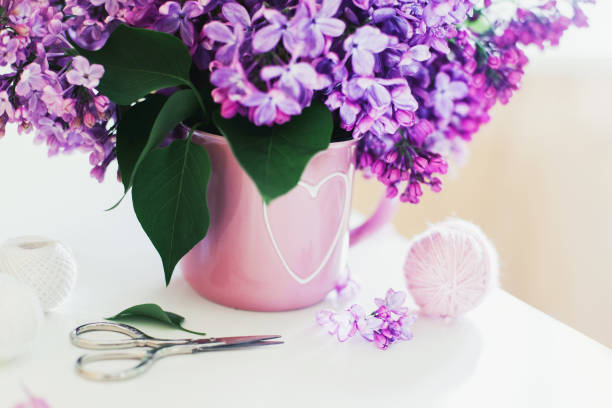 istock Bouquet of lilac, yarn, crochet hooks 1202436642