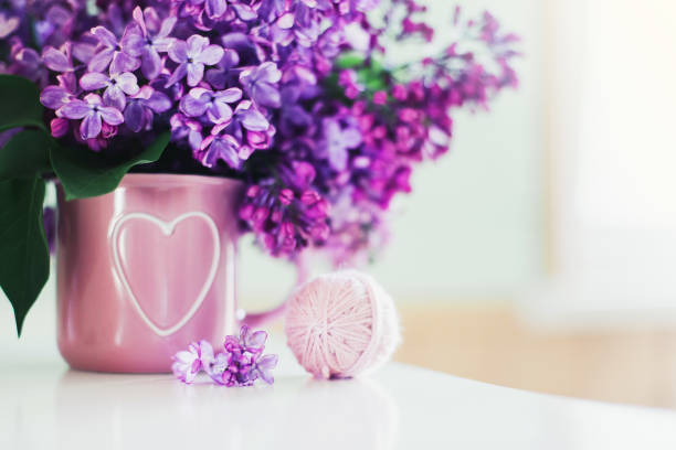 istock Bouquet of lilac, yarn, crochet hooks 1202436652