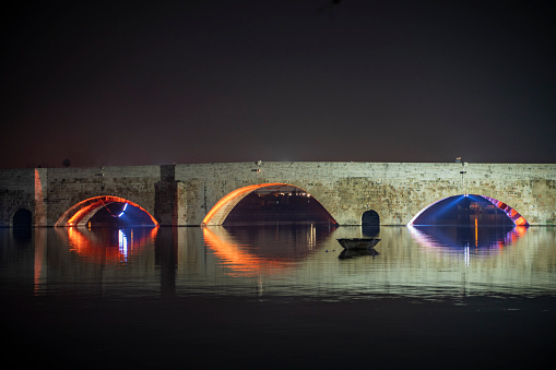 White bridge at night. Light effects. Modern engineering.