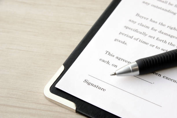 istock Contract sheet and ballpoint pen 1202437086