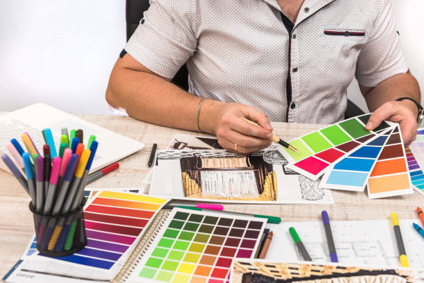 istock Engineer and architect concept - Designer creative working with  sketch plan blueprint and color sampler. 1202438096