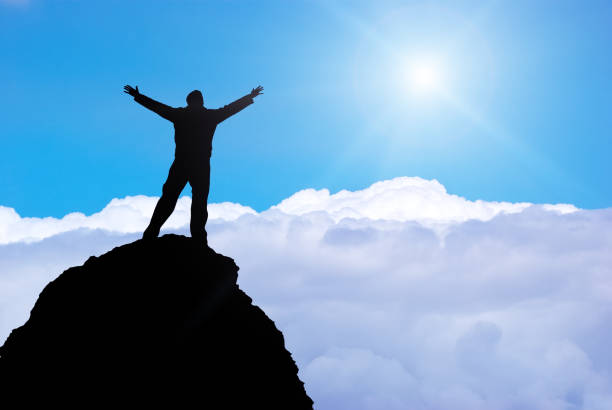 istock Man on the edge of cliff. 1202440189
