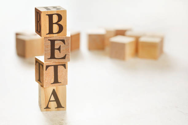 istock Four wooden cubes arranged in stack with word BETA on them, space for text image at down right corner 1202440627