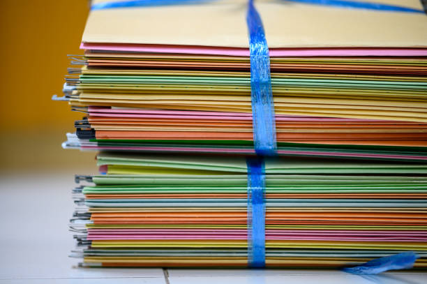 istock Colorful documents that the office is about to recycle 1202443659