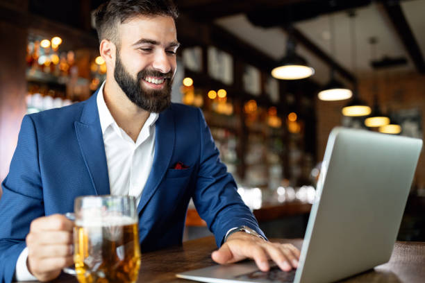 istock Handsome business man using laptop at his work break in restaurant 1202444879