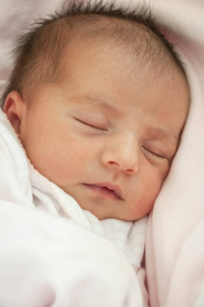 istock Newborn baby sleeping five days after birth 1202445081