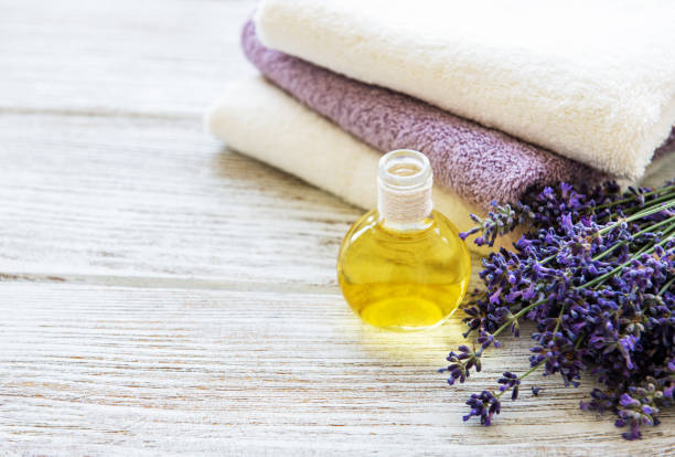 istock Lavender oil and lavender flowers 1202445470