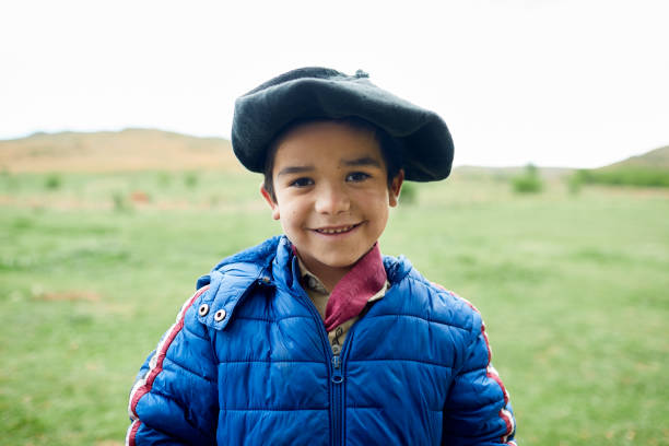 istock One gaucho little boy wearing a beret and looking at camera. 1202445623