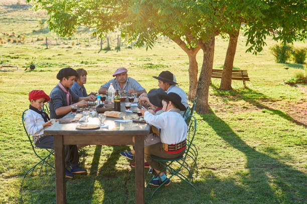 istock Family eating together on a sunny spring afternoon. 1202445727