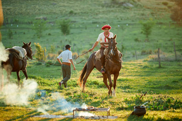 Horse riding after an Argentinian barbecue. Gaucho lifestyle. argentinian ethnicity stock pictures, royalty-free photos & images