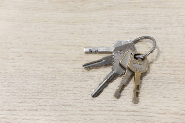 istock Shots House keys on a table wood. 1202445817