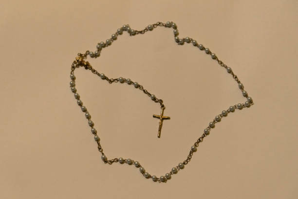 istock The image of a rosary or Catholic third and a crucifix pendant at its end 1202448740