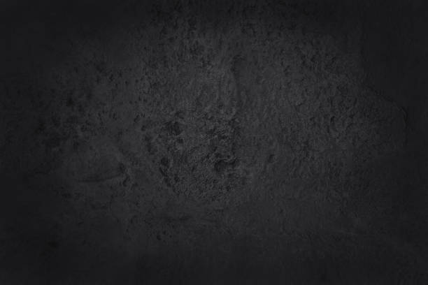 istock Dark grey black slate texture in natural pattern with high resolution for background and design art work. Black stone wall. 1202449140