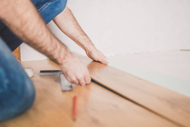 istock Finishing work at home - laying a laminate flooring 1202450474