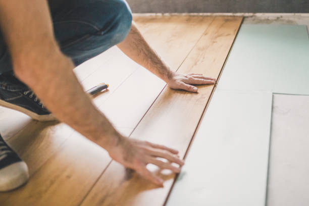 istock Wood floor imitation - simplicity of laminate installation 1202455209