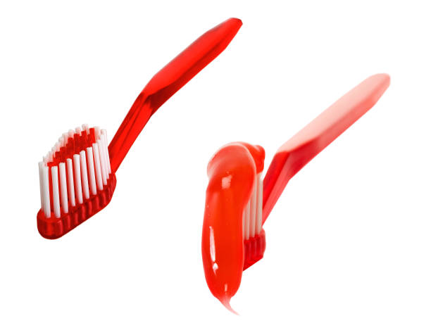 istock red toothbrush isolated on the background 1202455996