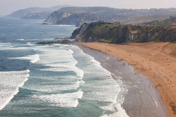 La Salvaje beach viewed from above. Basque country, Spain Spanish sandy coastline with surfers. Sopelana, Basque country, Spain sopelana stock pictures, royalty-free photos & images