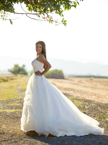 Beautiful bride in beautiful white wedding dress outdoor portrait