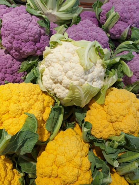 istock Yellow white and purple cauliflowers 1202457568