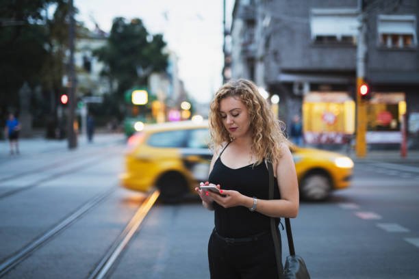 istock Woman Using Smart Phone In The City 1202457848