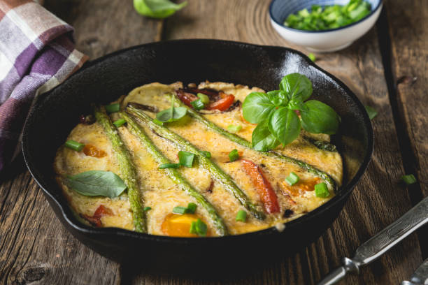istock Frittata. Italian omelet with asparagus and bell pepper 1202458560