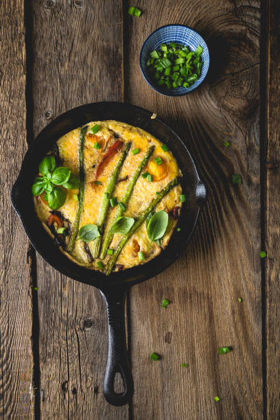 istock Frittata. Italian omelet with asparagus and bell pepper 1202458571