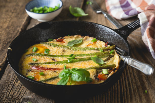 istock Frittata. Italian omelet with asparagus and bell pepper 1202458608