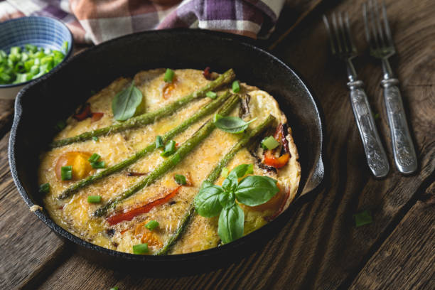 istock Frittata. Italian omelet with asparagus and bell pepper 1202458644