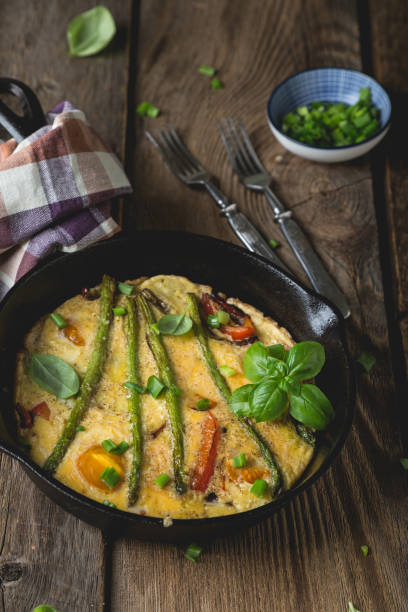 istock Frittata. Italian omelet with asparagus and bell pepper 1202458819